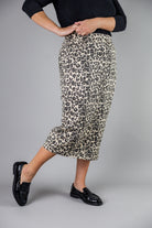 Nuggles® denim midi skirt with soft stretch fabric, wide elastic waistband, modest length, and functional pockets. Available in 27", 31", and 34" lengths.