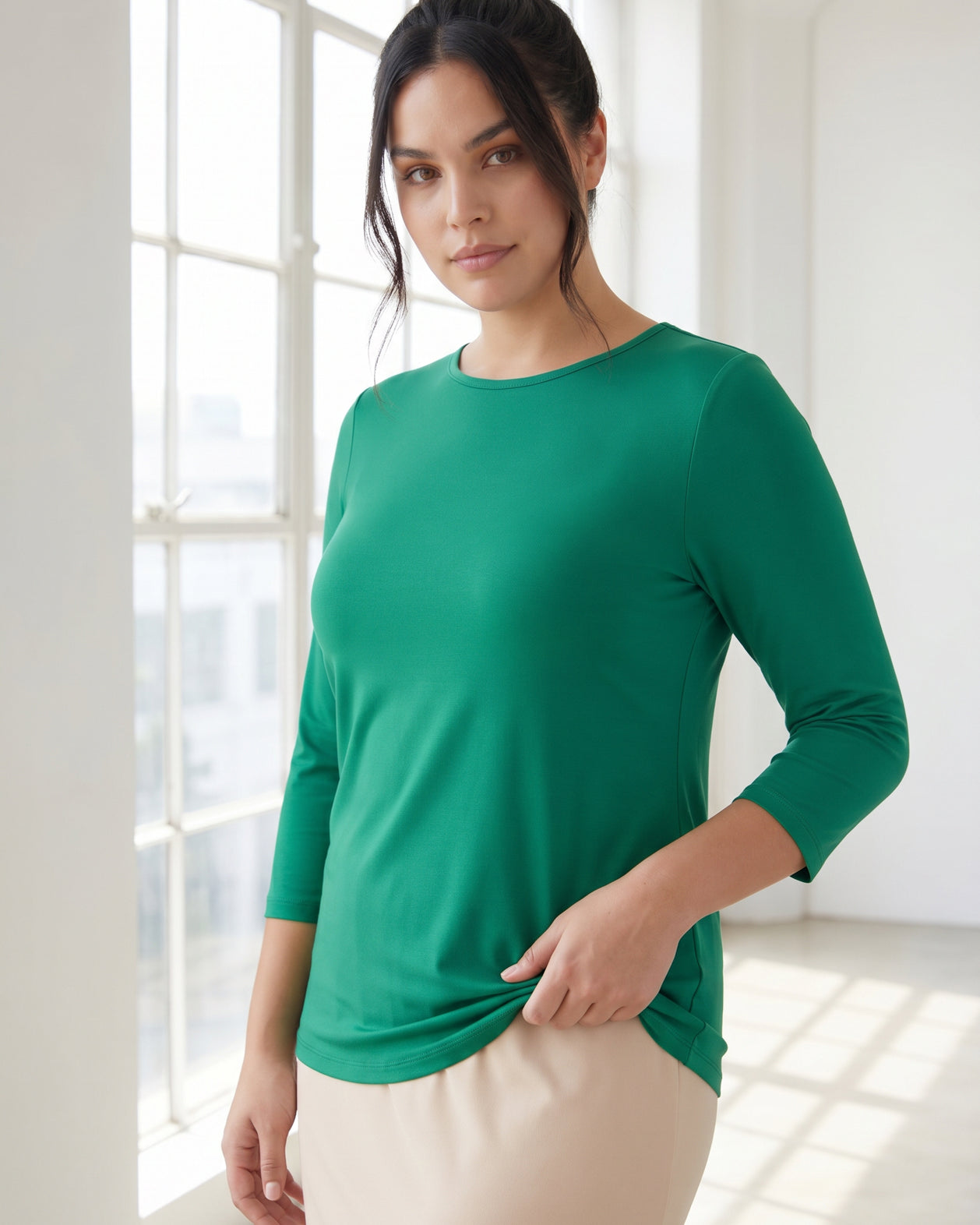 Model wearing Nuggles® 3/4 Essential Tee in Kelly Green