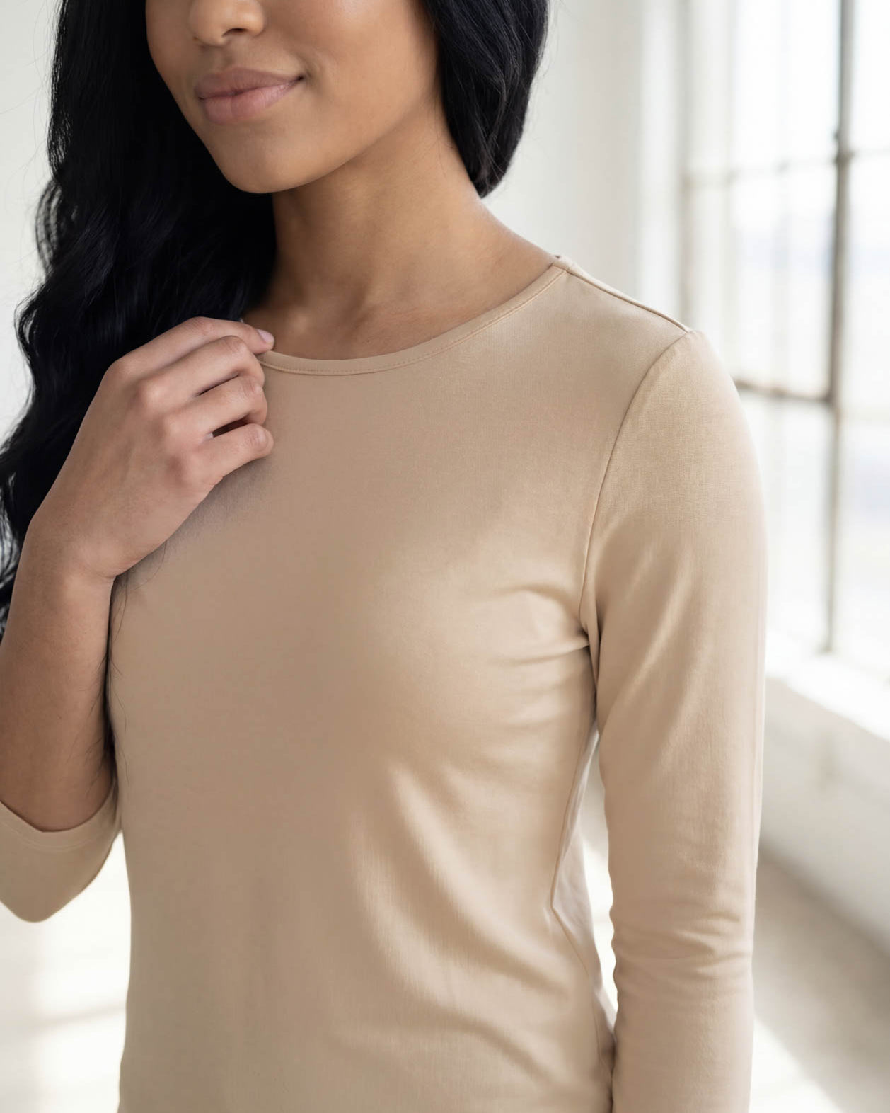 Model wearing Nuggles® 3/4 Essential Tee in Khaki