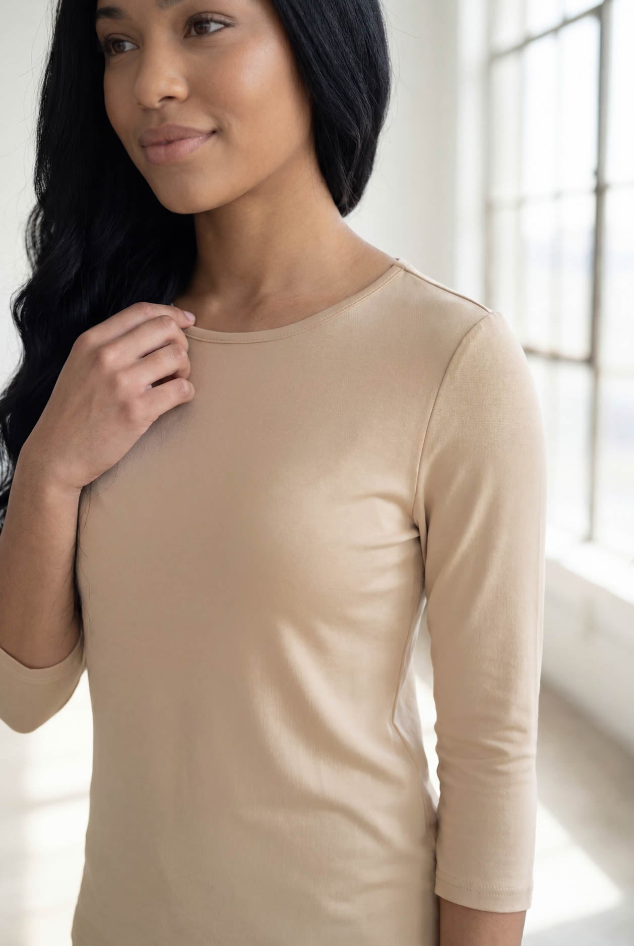 Model wearing Nuggles® 3/4 Essential Tee in Khaki