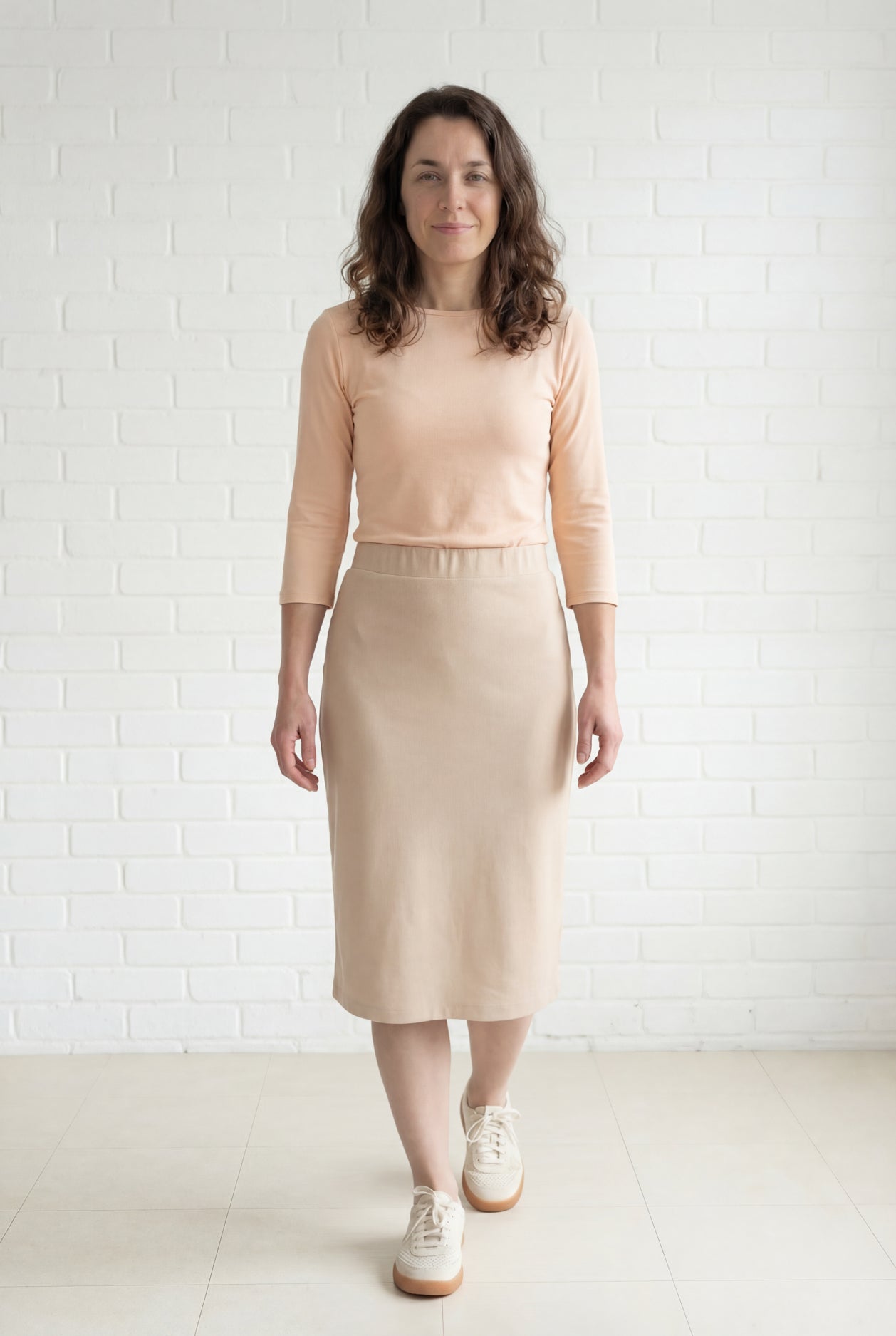 Model wearing Nuggles® 27" Relaxed Midi Skirt in Khaki
