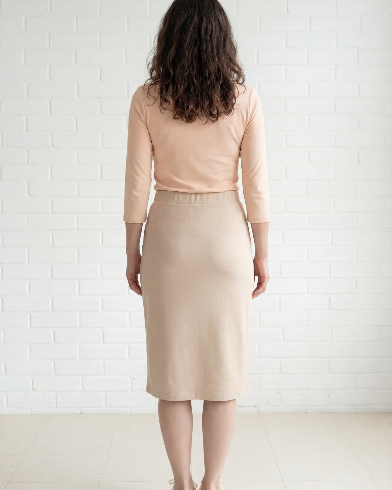 Model wearing Nuggles® 27" Relaxed Midi Skirt in Khaki