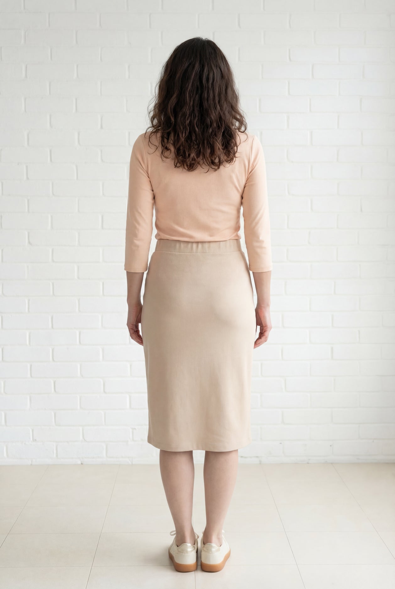 Model wearing Nuggles® 27" Relaxed Midi Skirt in Khaki