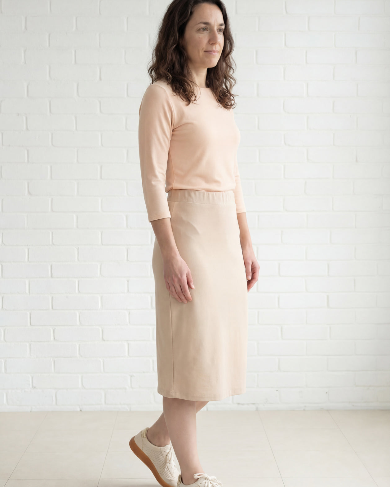 Model wearing Nuggles® 27" Relaxed Midi Skirt in Khaki
