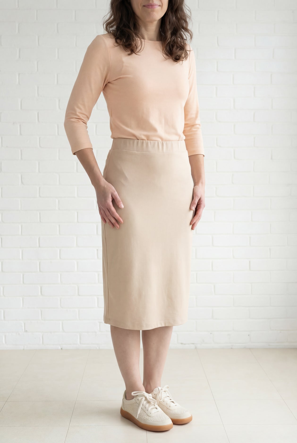 Model wearing Nuggles® 27" Relaxed Midi Skirt in Khaki