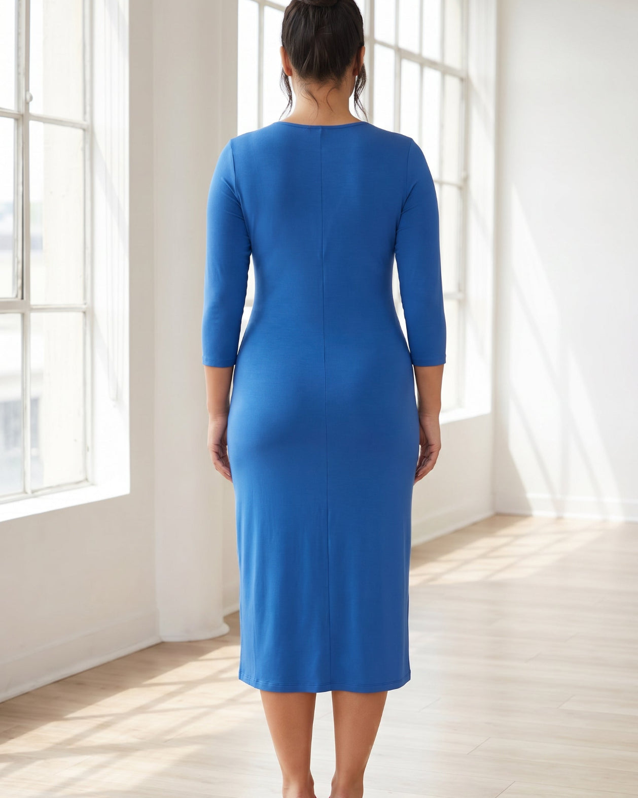 Model wearing Nuggles® Midi Layering Dress in Lapiz Blue