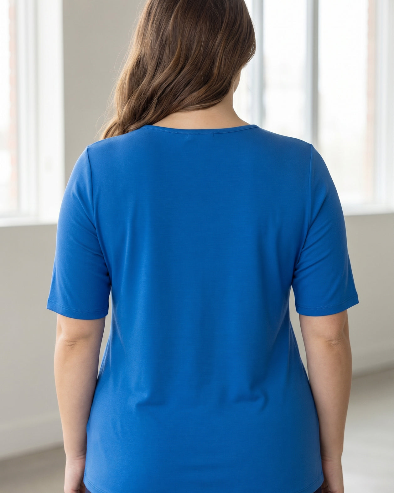 Model wearing the Nuggles® Essential Half Sleeve Tee in Lapiz Blue