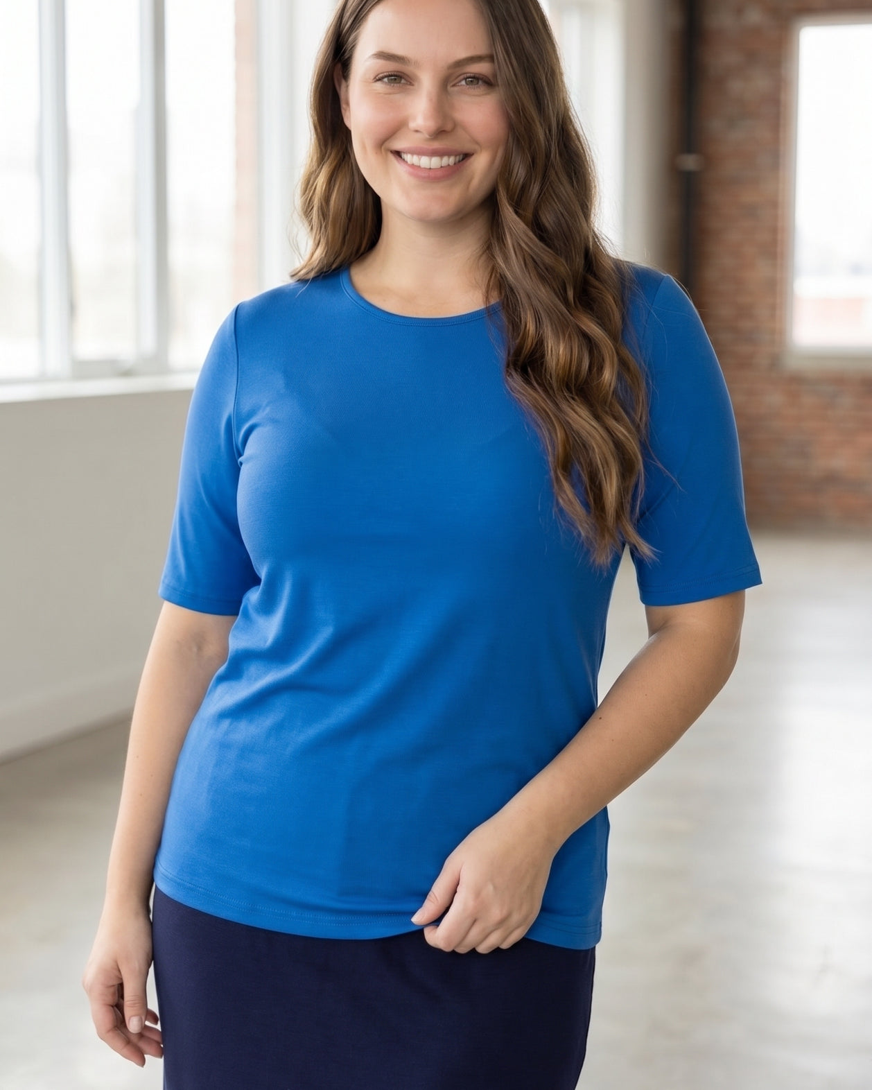 Model wearing the Nuggles® Essential Half Sleeve Tee in Lapiz Blue