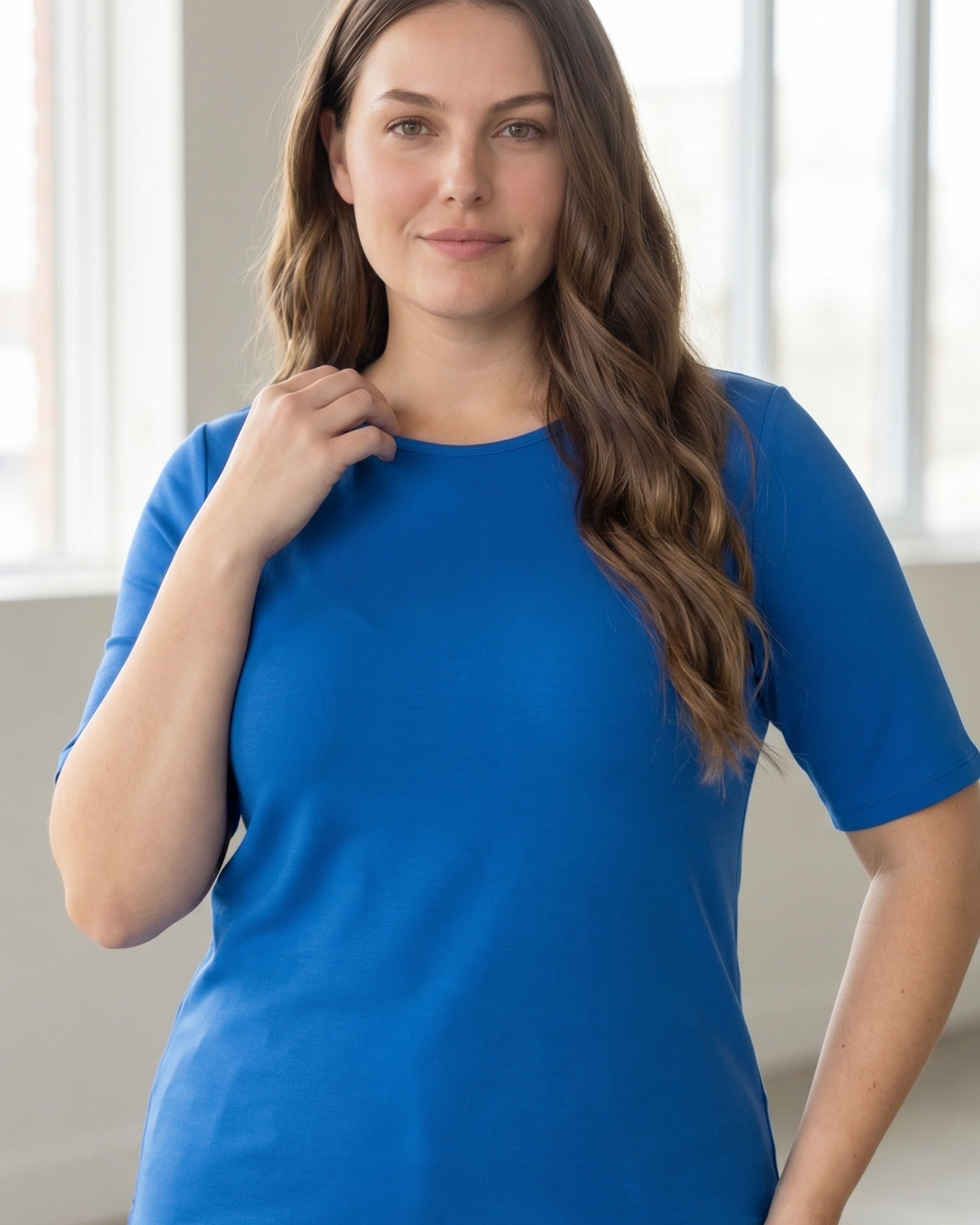 Model wearing the Nuggles® Essential Half Sleeve Tee in Lapiz Blue