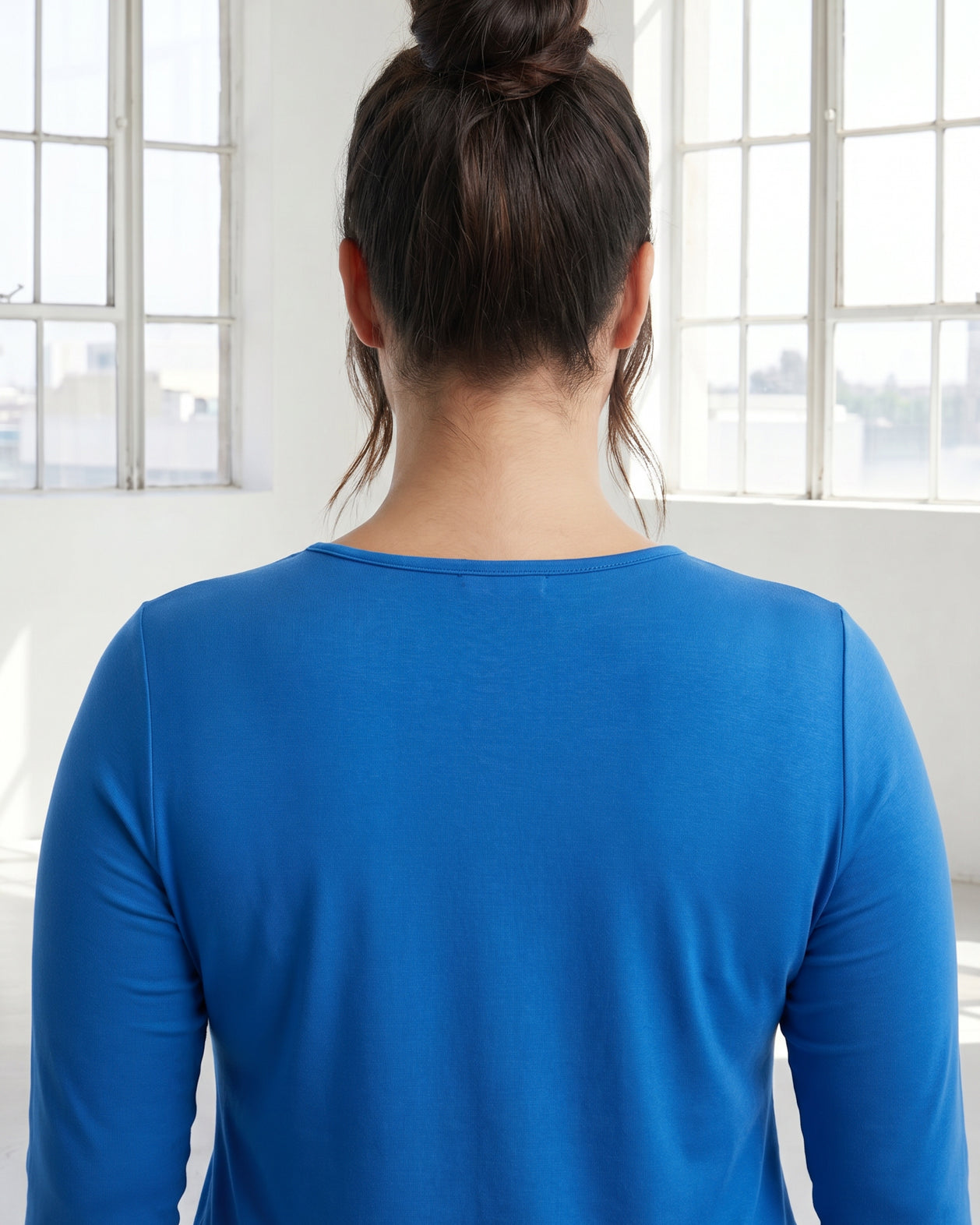 Model wearing Nuggles® 3/4 Essential Tee in Lapiz Blue