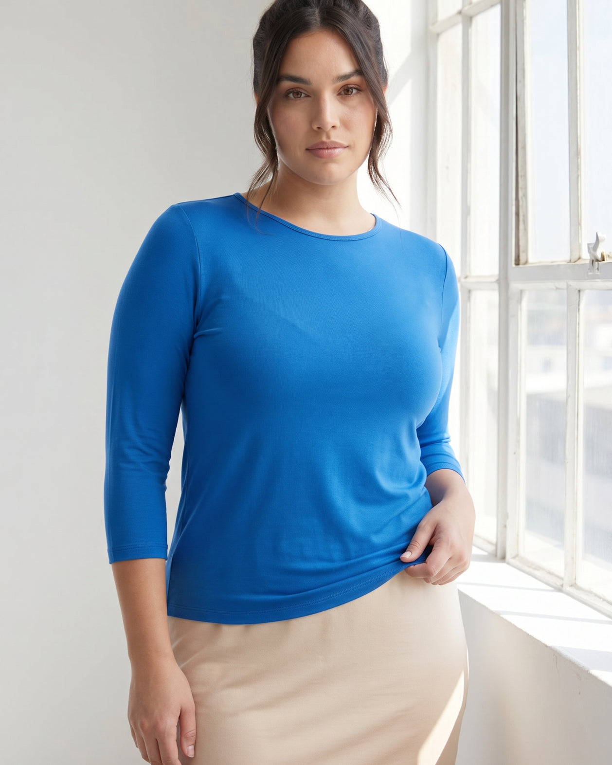 Model wearing Nuggles® 3/4 Essential Tee in Lapiz Blue