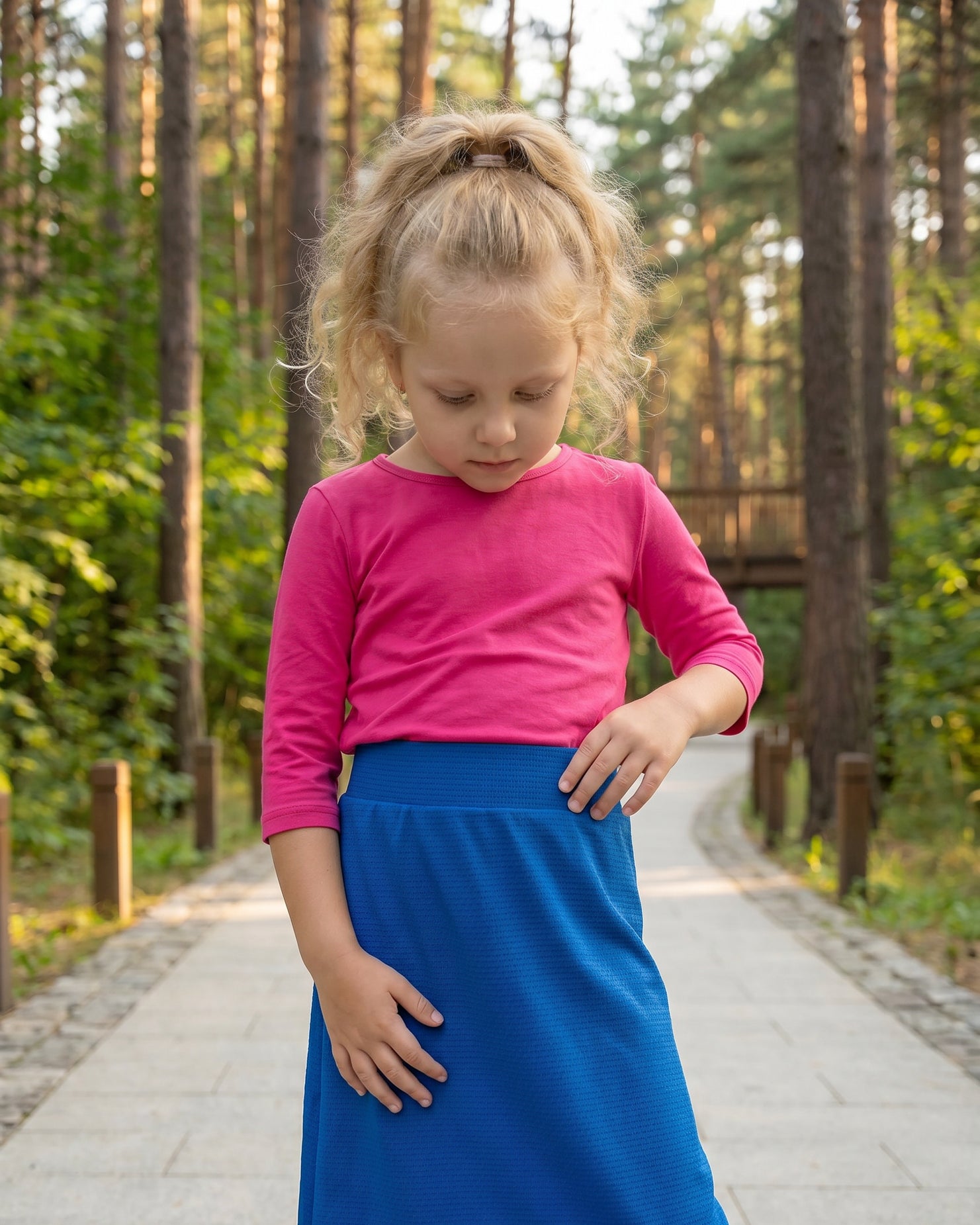 Model wearing Nuggles® Girls All-Sport Skirt in Lapiz Blue