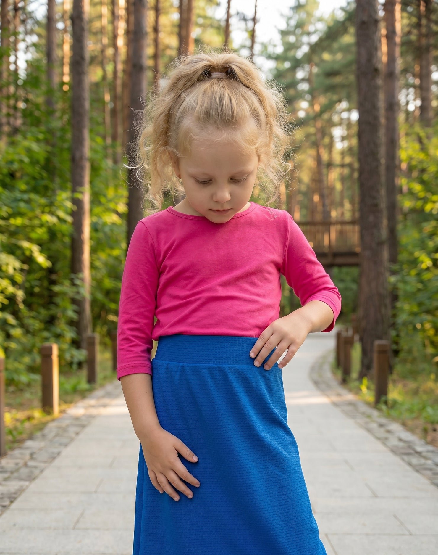 Model wearing Nuggles® Girls All-Sport Skirt in Lapiz Blue