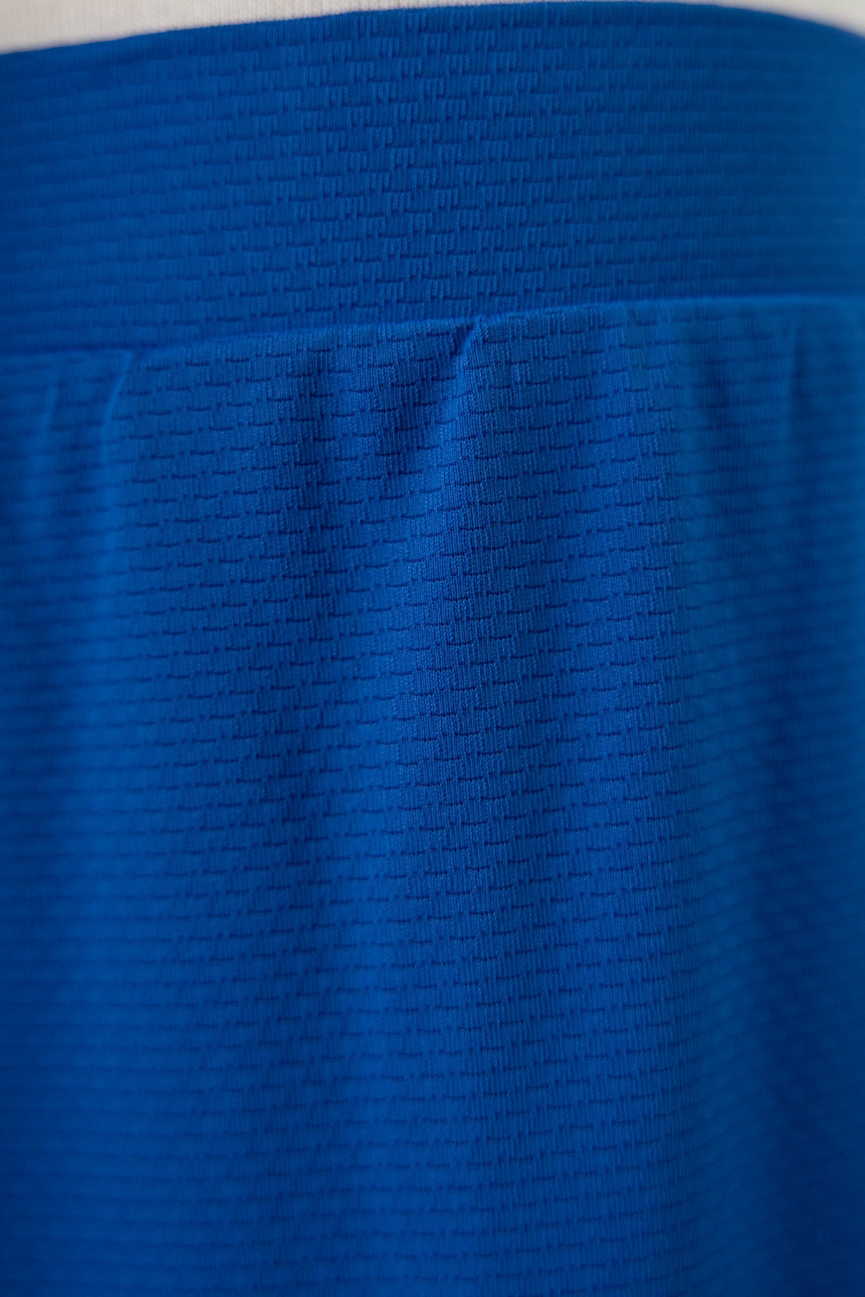 Model wearing Nuggles® Girls All-Sport Skirt in Lapiz Blue