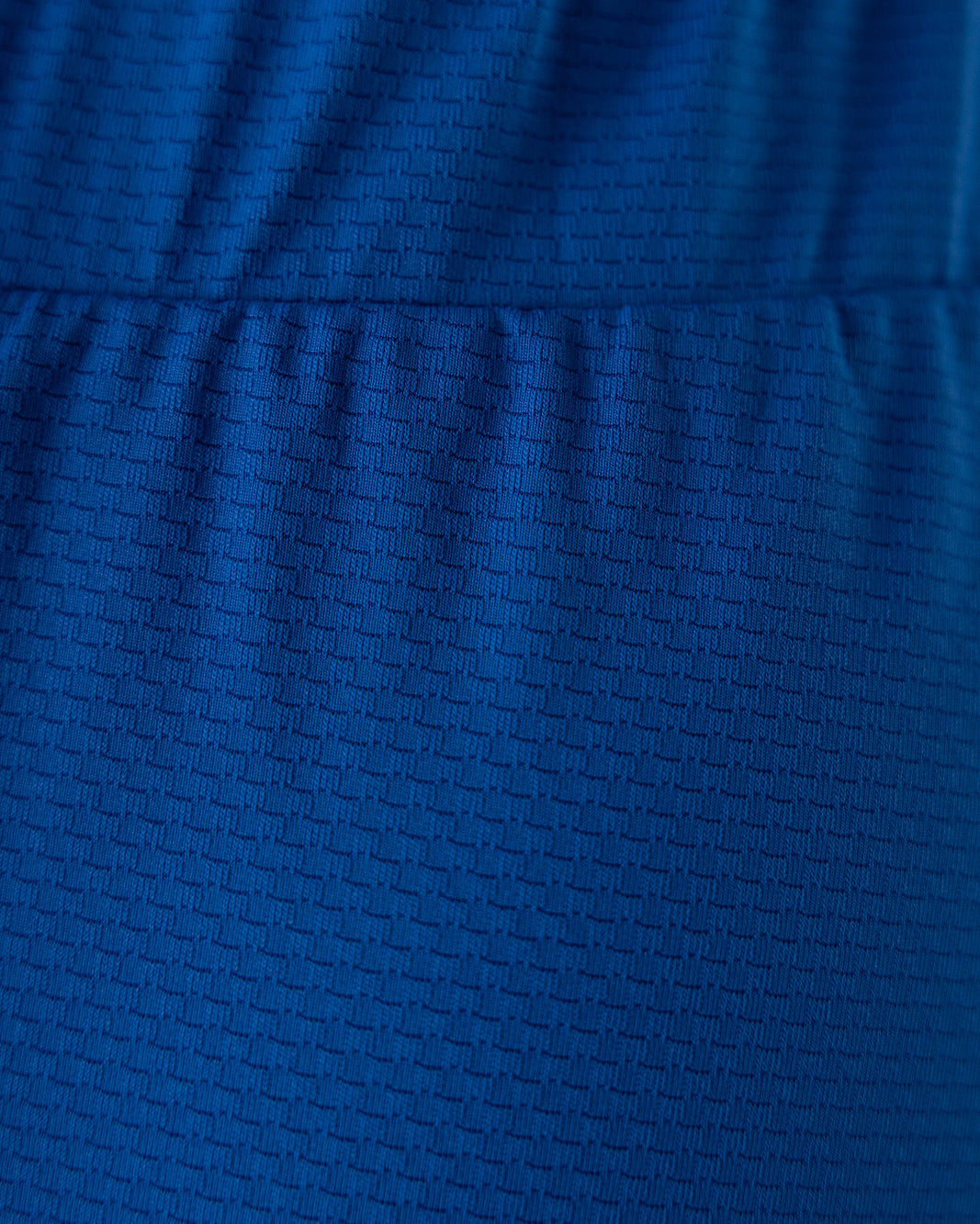 Model wearing Nuggles® 27" All-Sport Skirt in Lapiz Blue