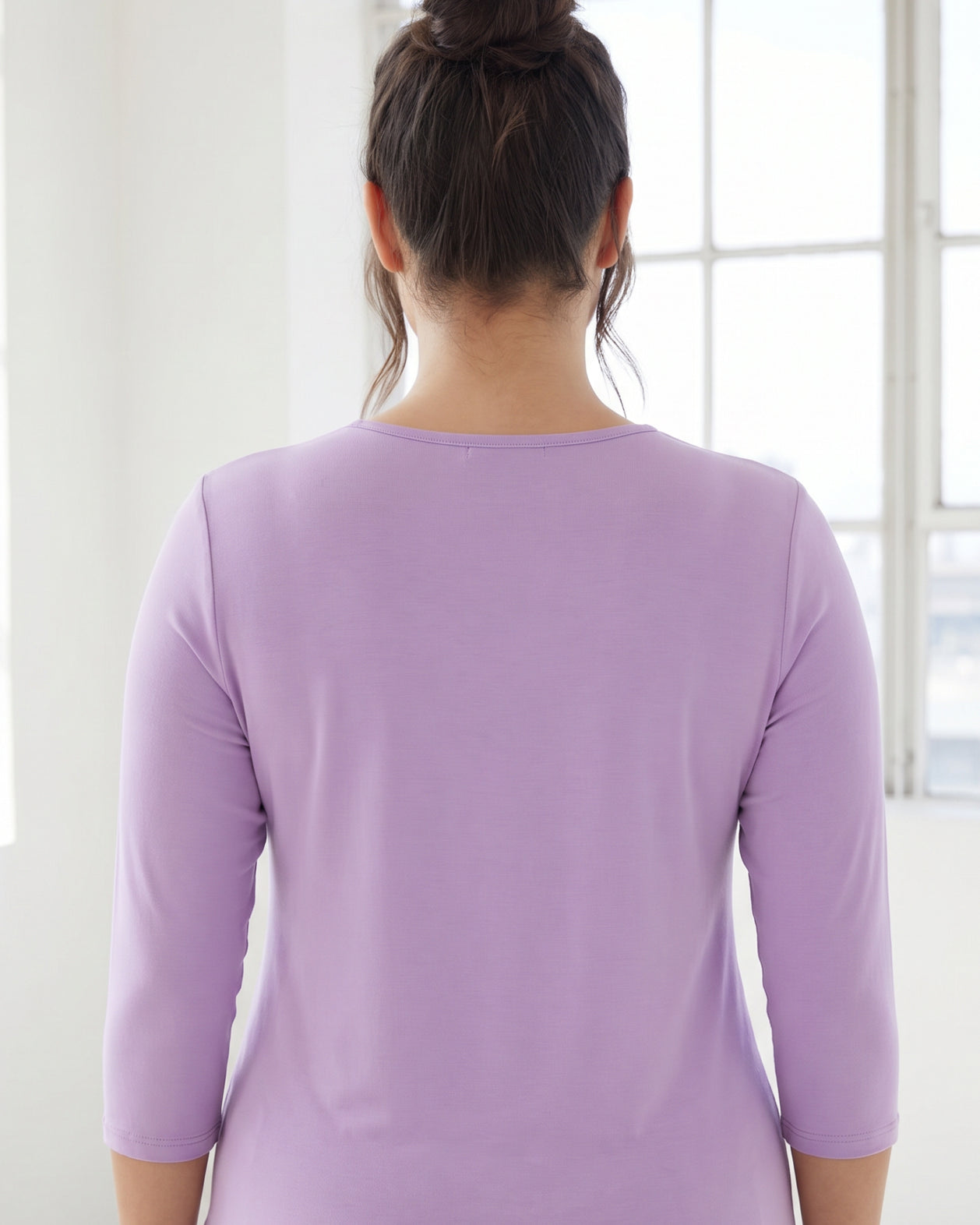 Model wearing Nuggles® 3/4 Essential Tee in Lavender