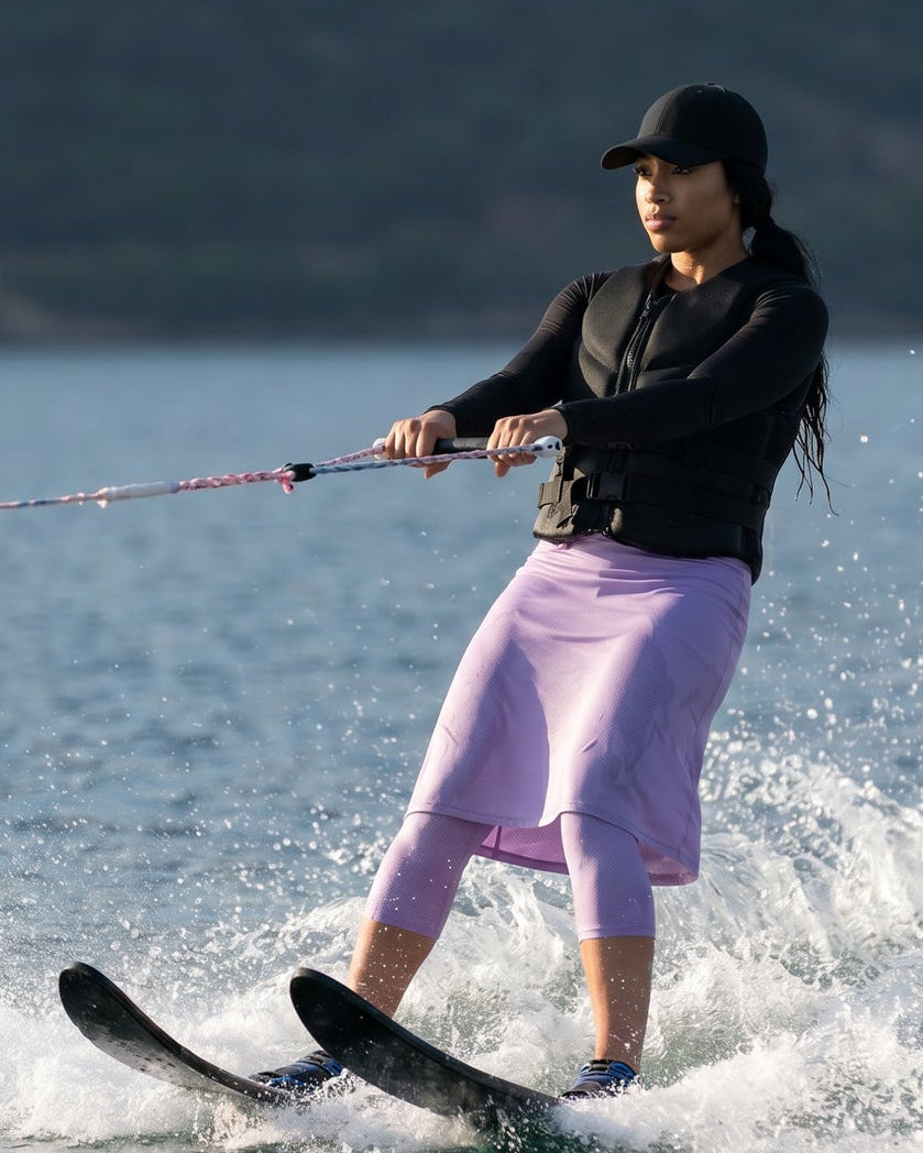 Model wearing Nuggles® 27"All-Sport Skirt in Lavender