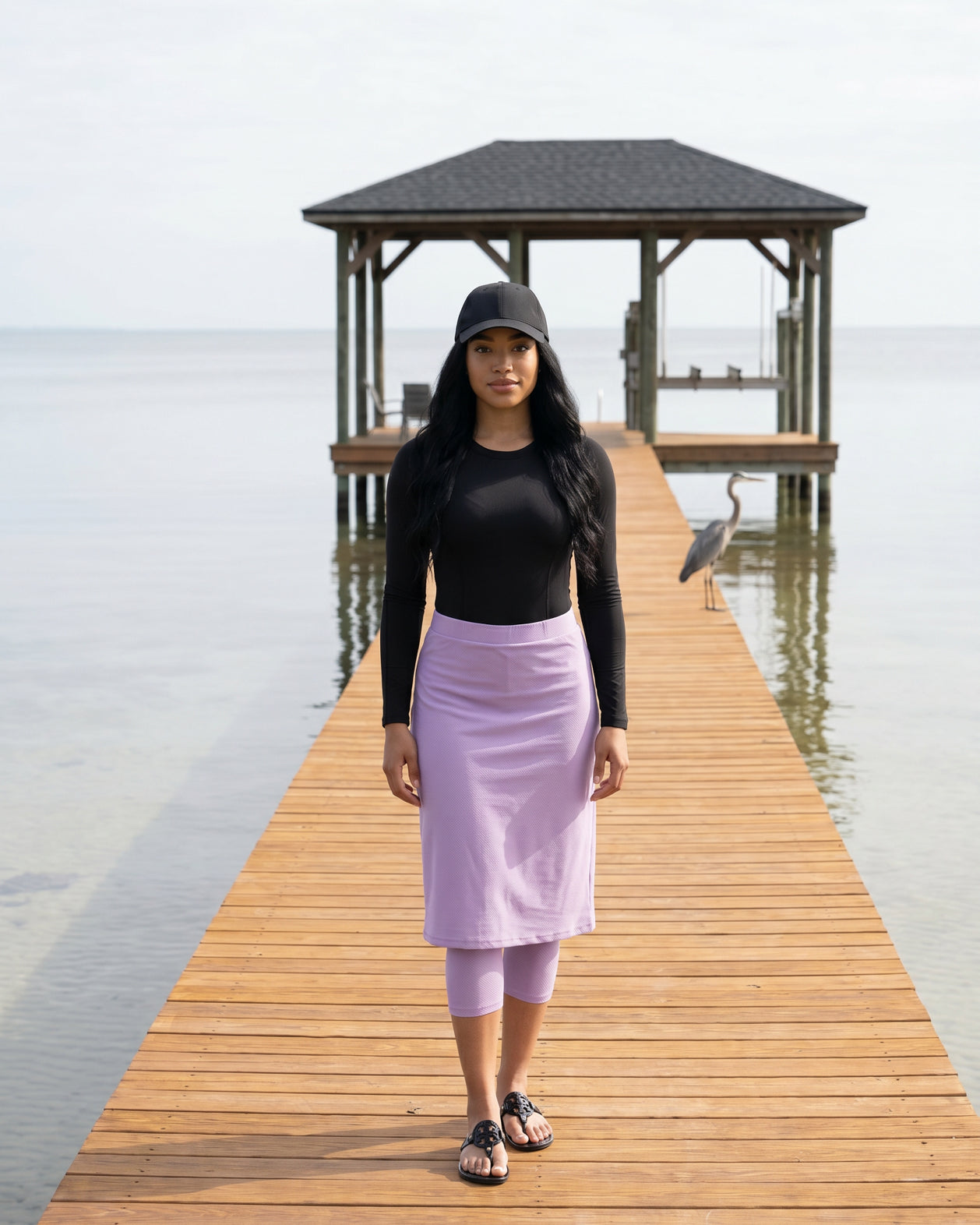 Model wearing Nuggles® 27"All-Sport Skirt in Lavender