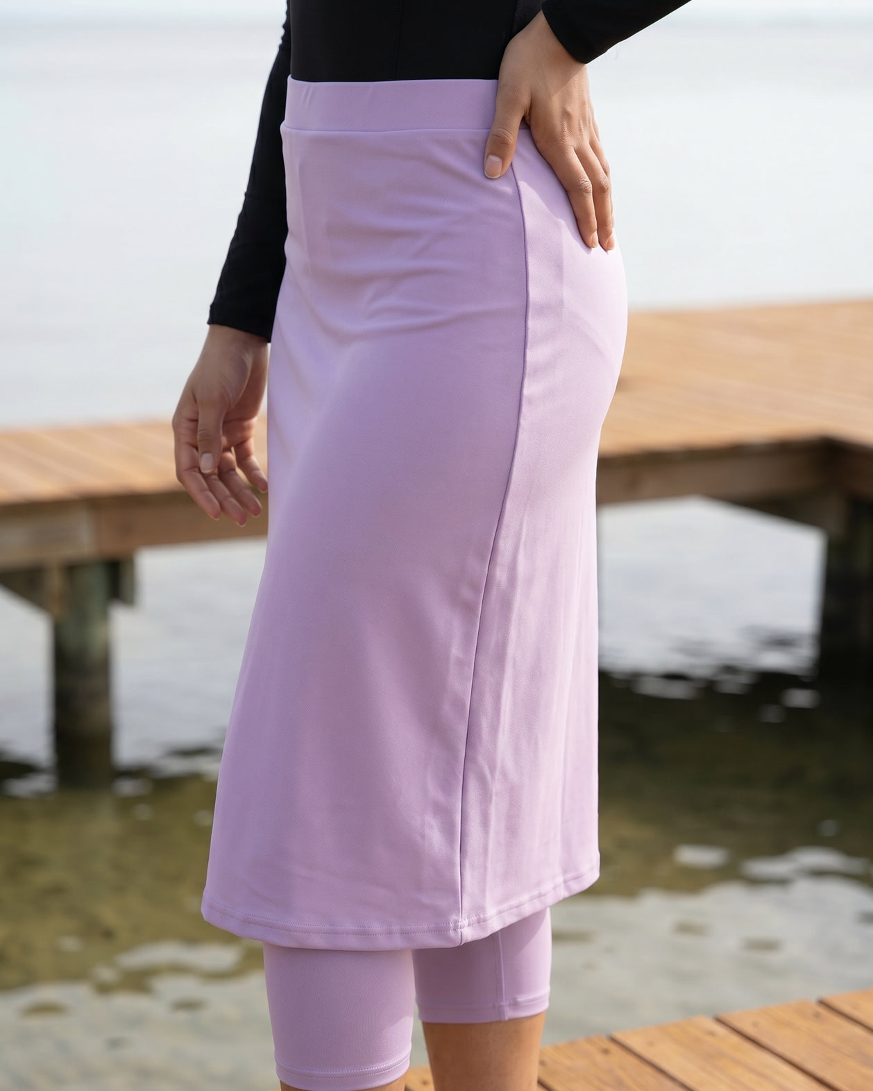 Model wearing Nuggles® 27"All-Sport Skirt in Lavender