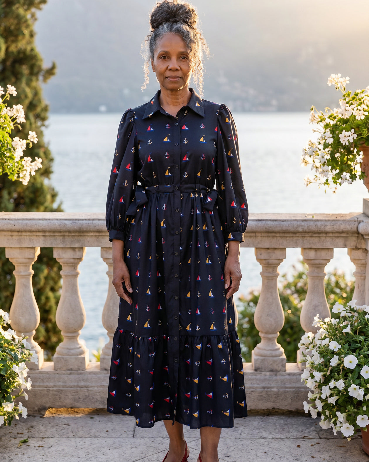 A picture of an older women wearing a blue button down dress.