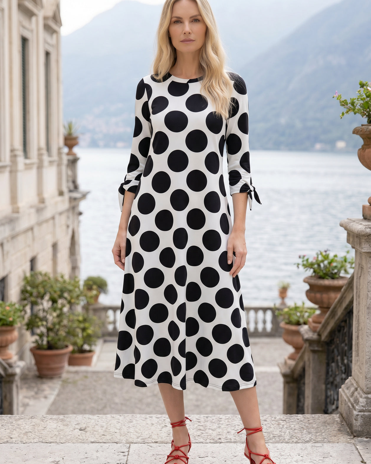 Model wearing Nuggles® Gracie Dress in Midnight Dot