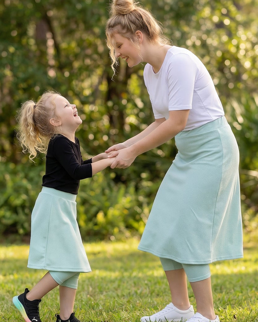 Model wearing Nuggles® Girls All-Sport Skirt in Mint