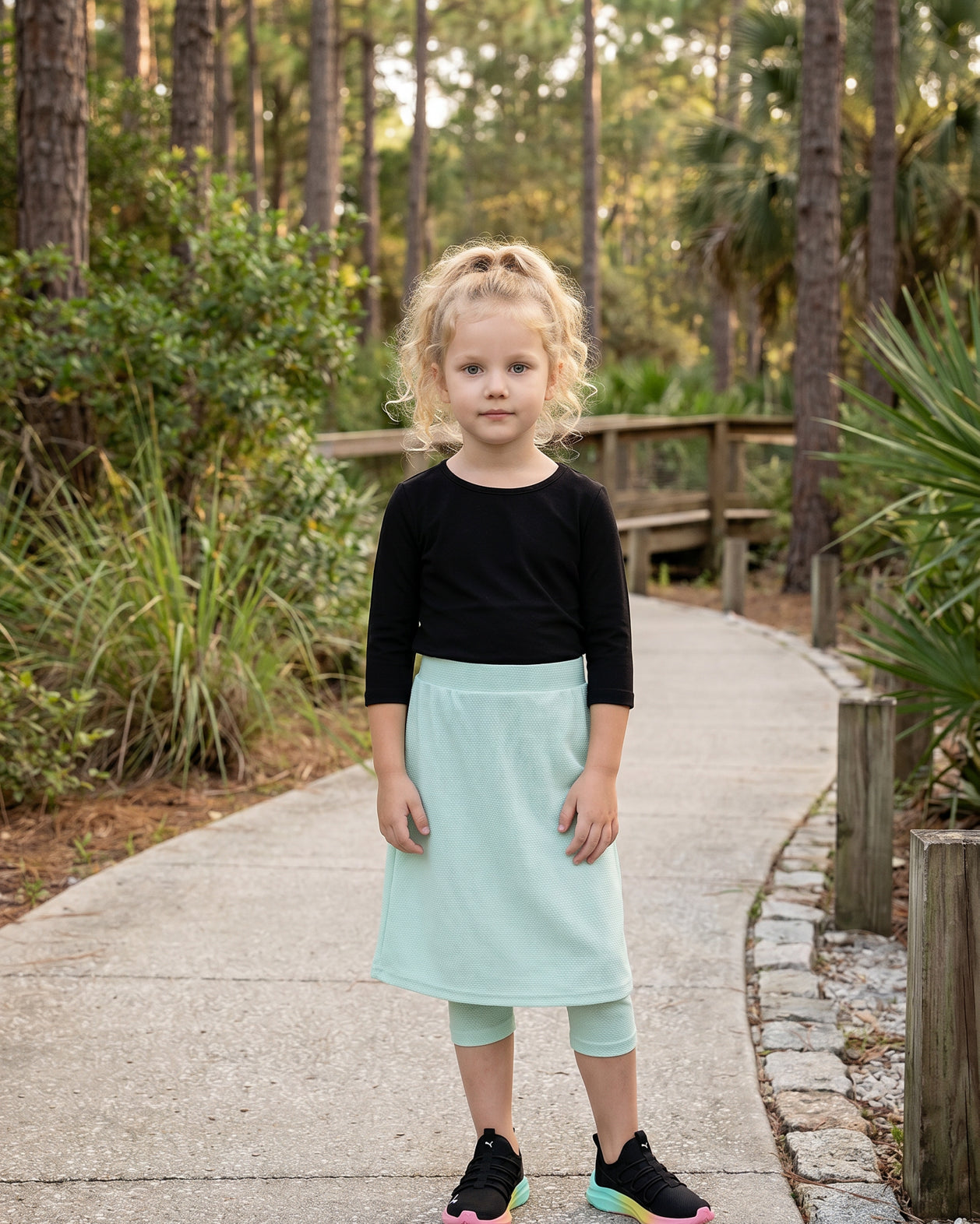 Model wearing Nuggles® Girls All-Sport Skirt in Mint