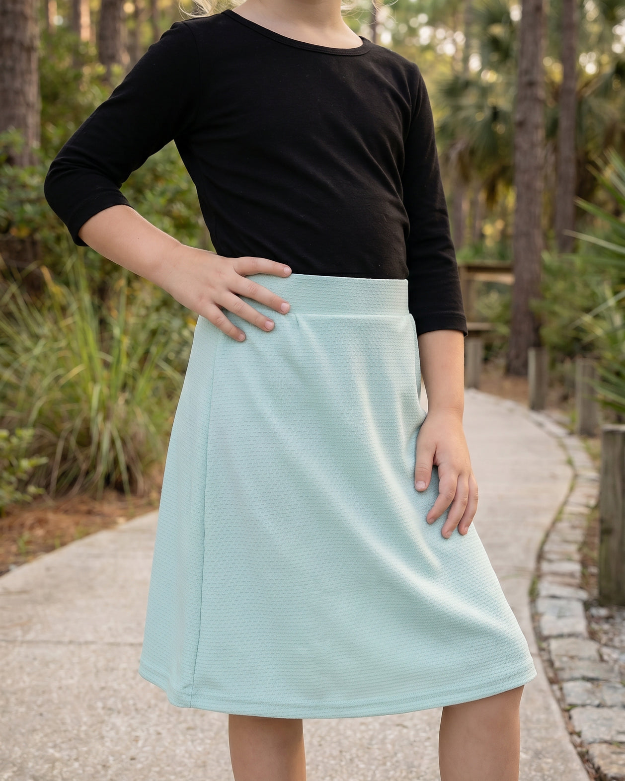 Model wearing Nuggles® Girls All-Sport Skirt in Mint