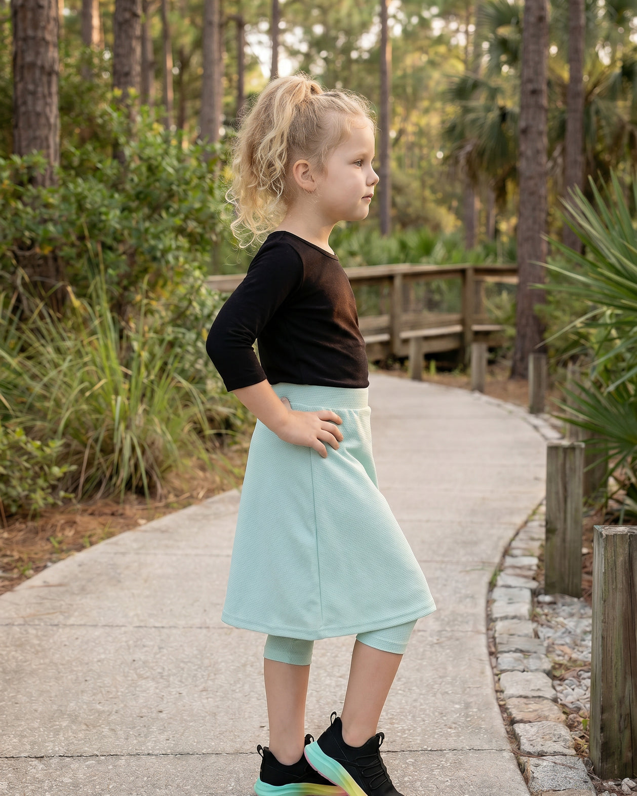 Model wearing Nuggles® Girls All-Sport Skirt in Mint