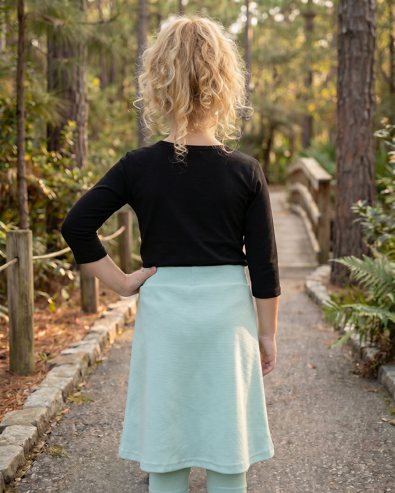 Model wearing Nuggles® Girls All-Sport Skirt in Mint