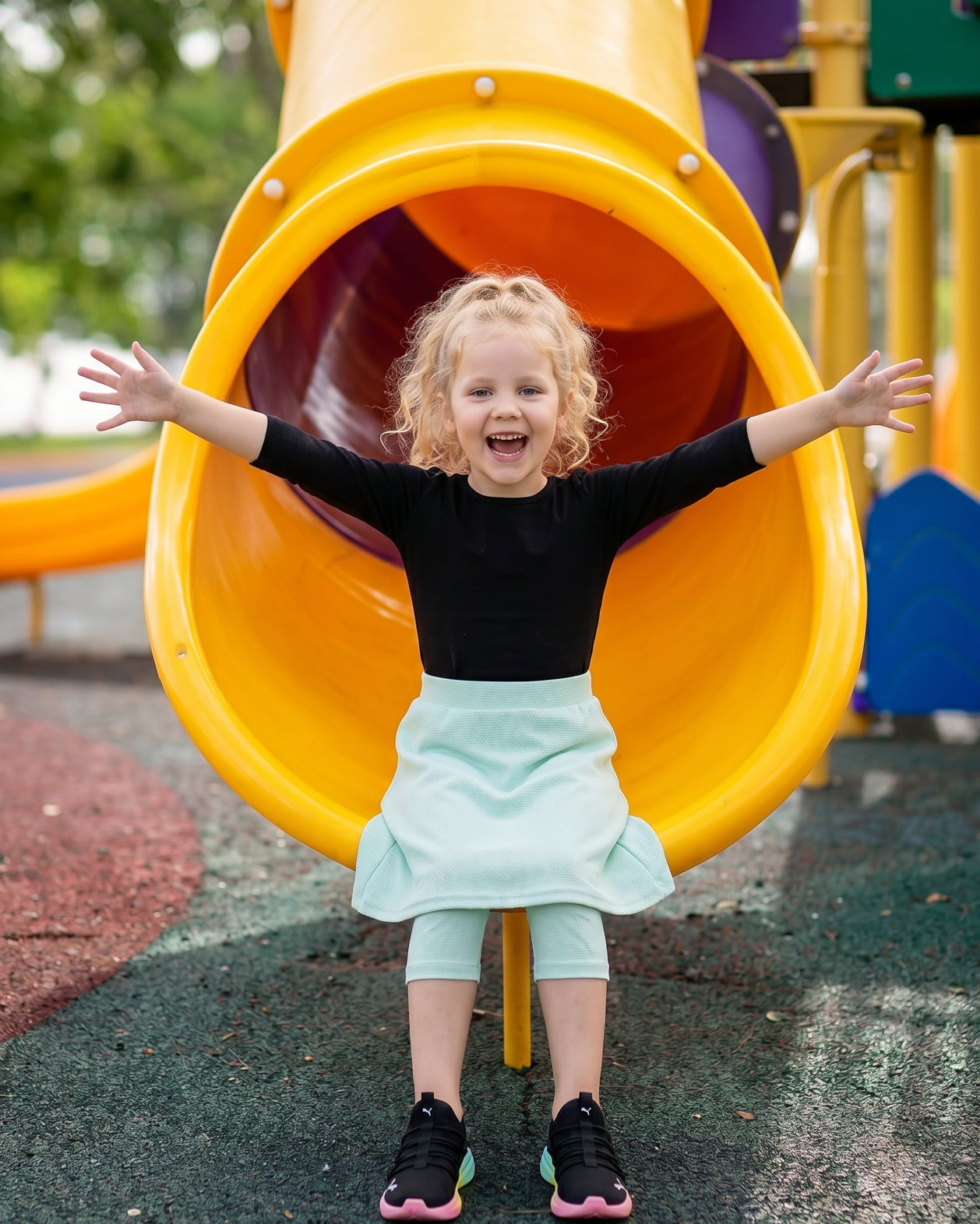 Model wearing Nuggles® Girls All-Sport Skirt in Mint