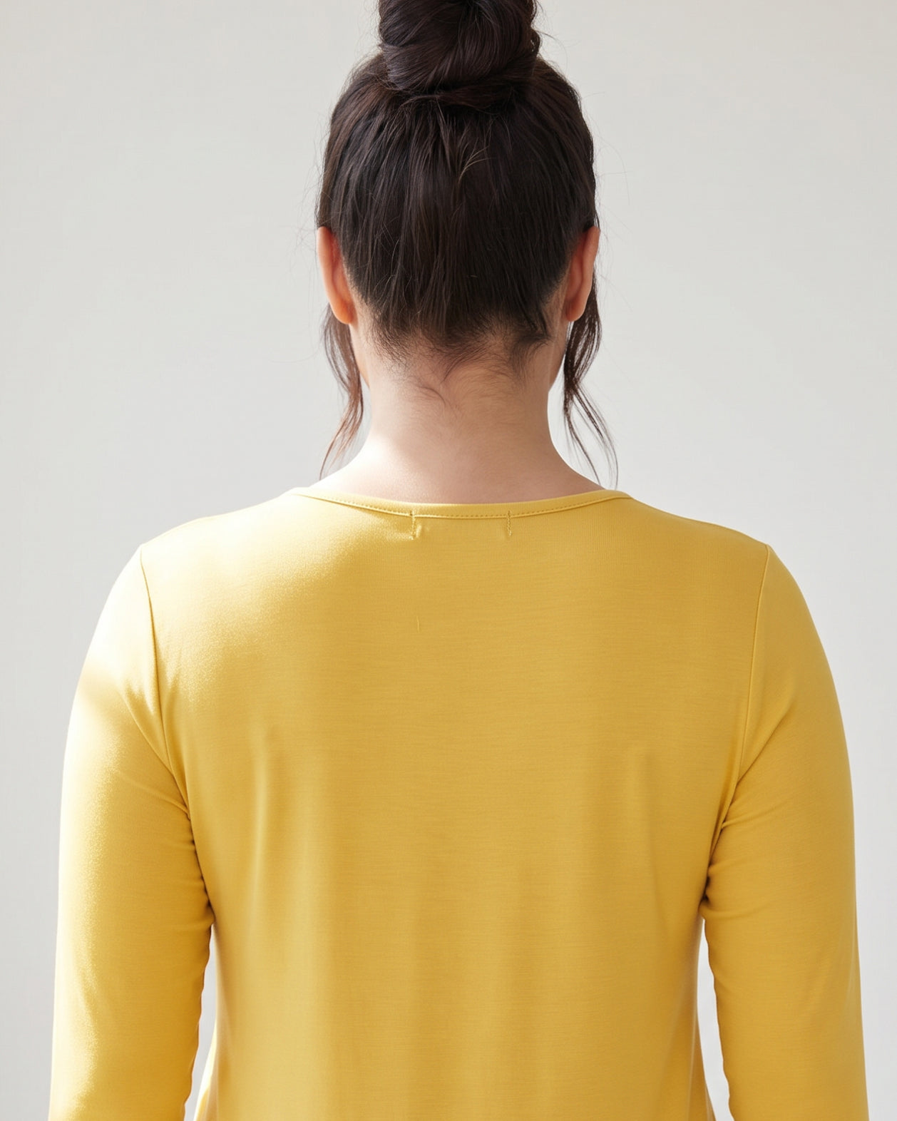 Model wearing Nuggles® 3/4 Essential Tee in Mustard