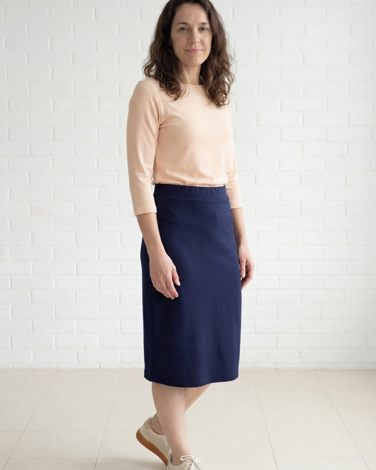 Model wearing Nuggles® 27" Relaxed Midi Skirt in Navy