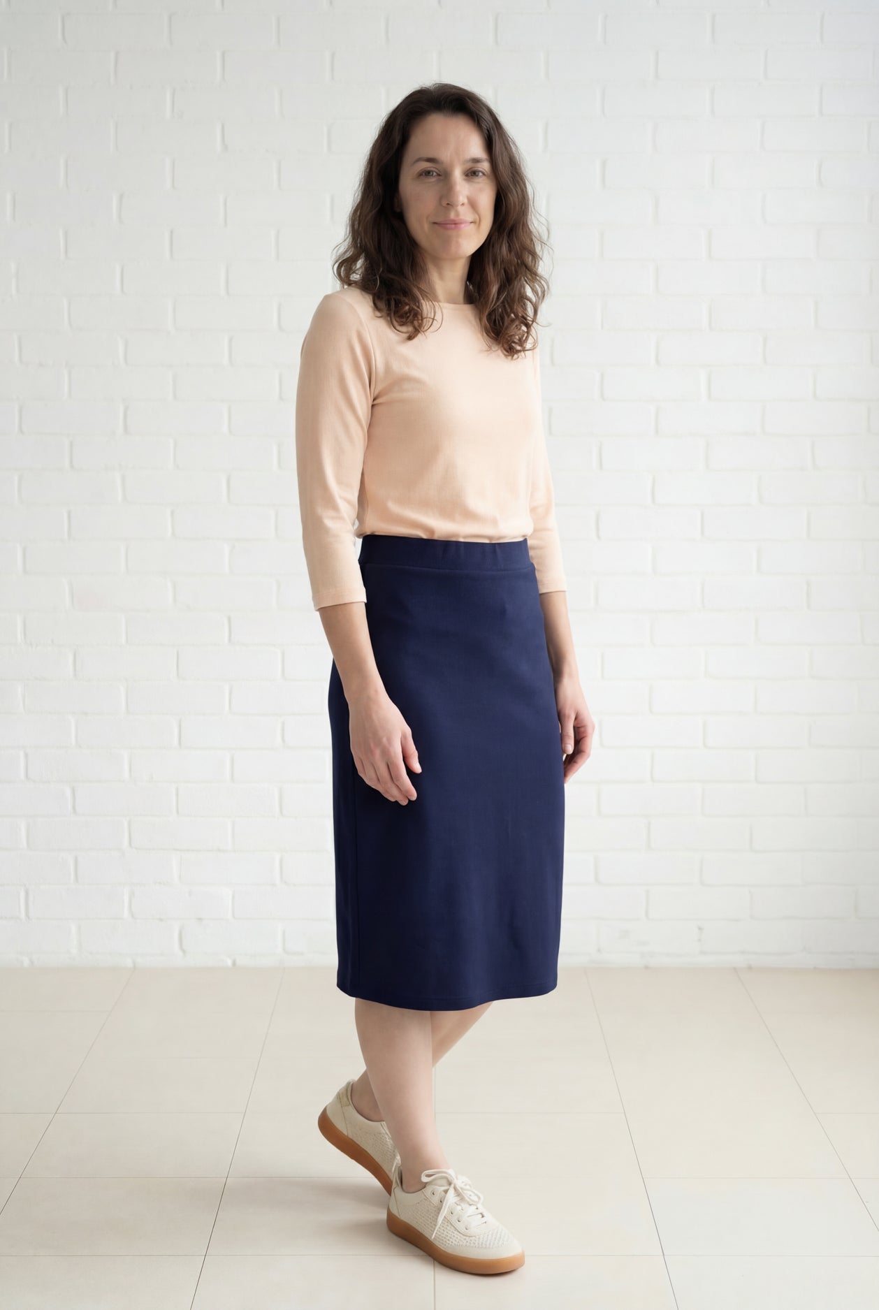 Model wearing Nuggles® 27" Relaxed Midi Skirt in Navy