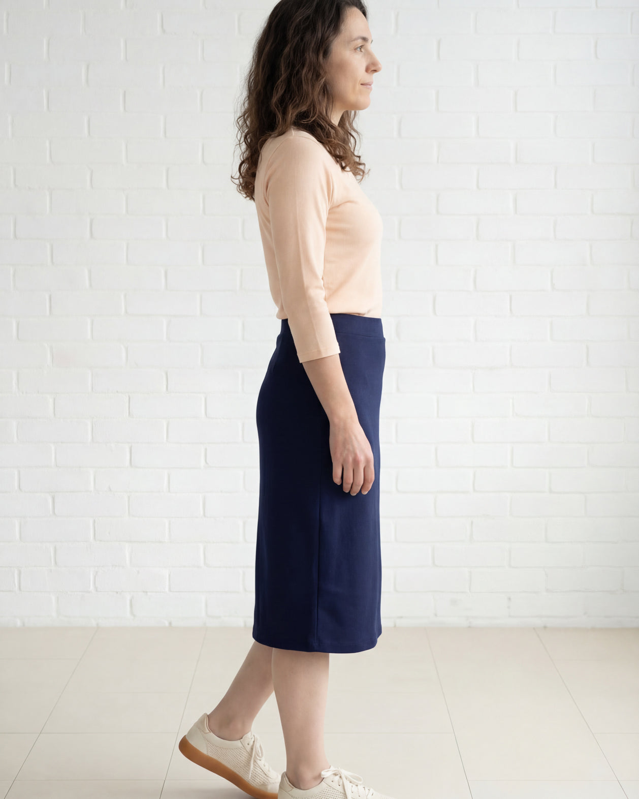 Model wearing Nuggles® 27" Relaxed Midi Skirt in Navy