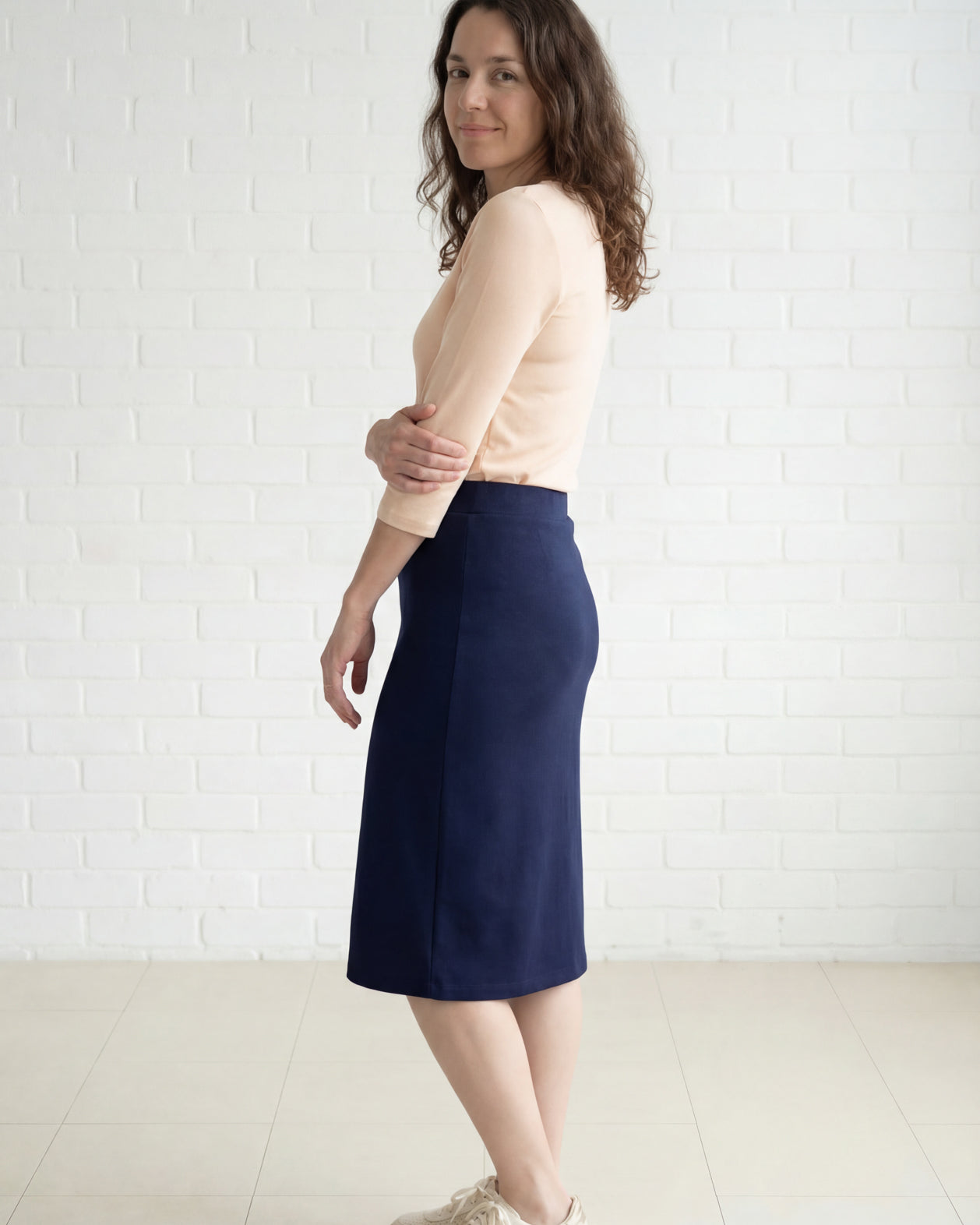 Model wearing Nuggles® 27" Relaxed Midi Skirt in Navy