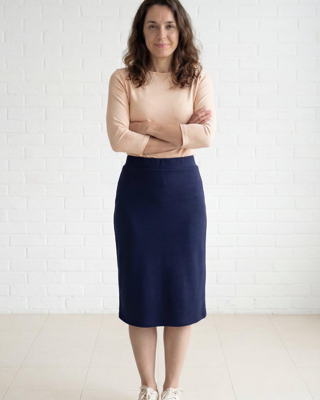 Model wearing Nuggles® 27" Relaxed Midi Skirt in Navy