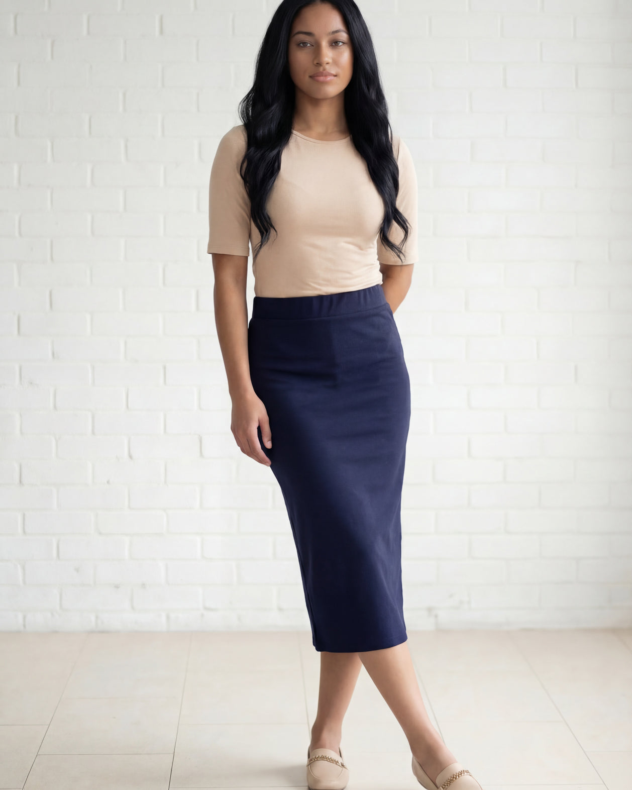 Model wearing Nuggles® 31" Relaxed Midi Skirt in Navy