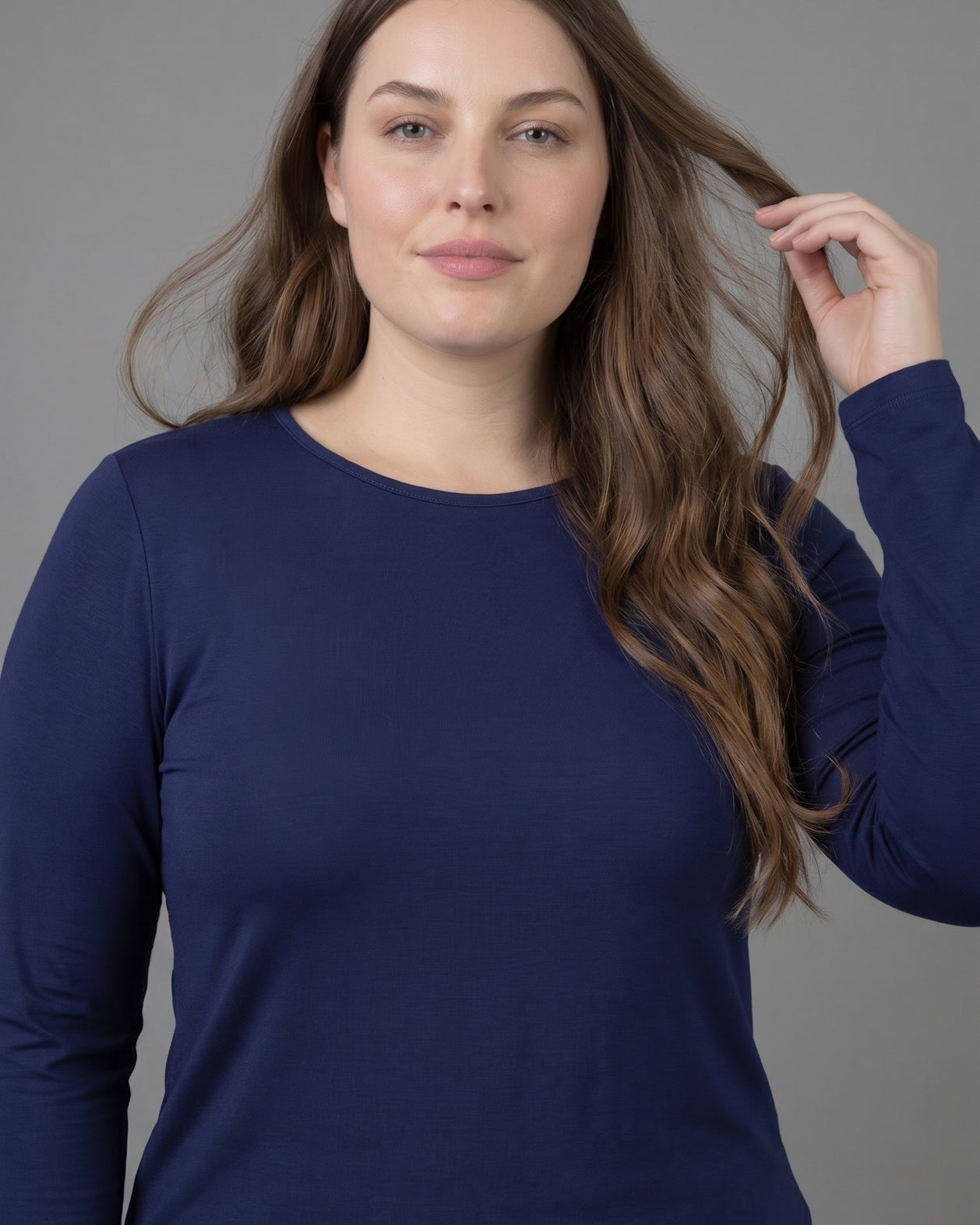 Model wearing Nuggles® Long Sleeve Essential Tee in Navy