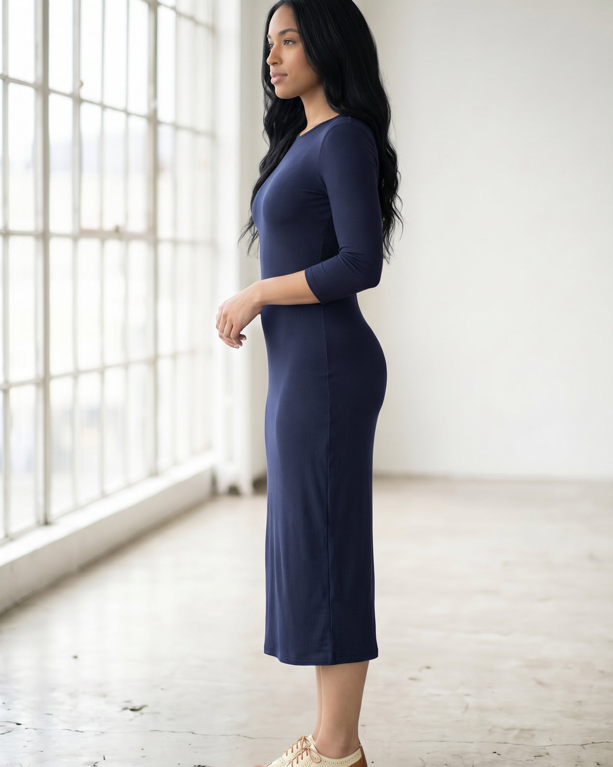 Model wearing Nuggles® Ribbed Midi Layering Dress in Navy