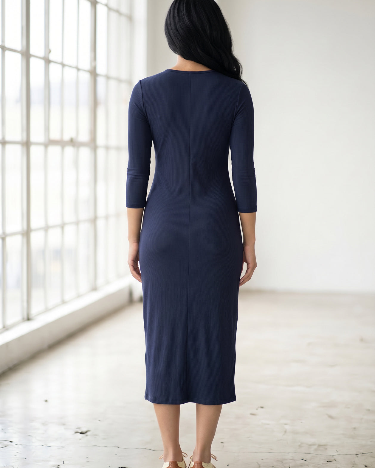 Model wearing Nuggles® Ribbed Midi Layering Dress in Navy