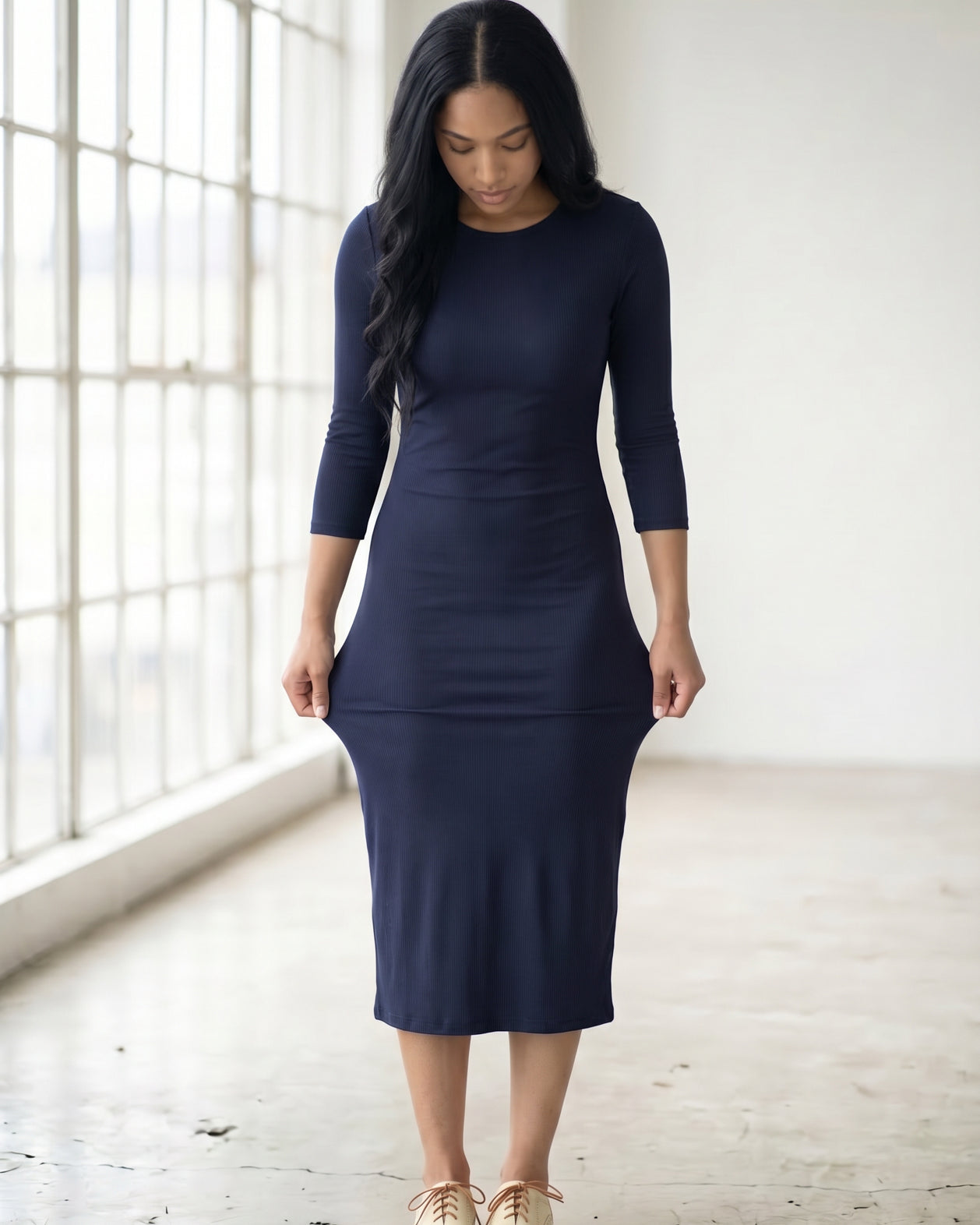 Model wearing Nuggles® Ribbed Midi Layering Dress in Navy