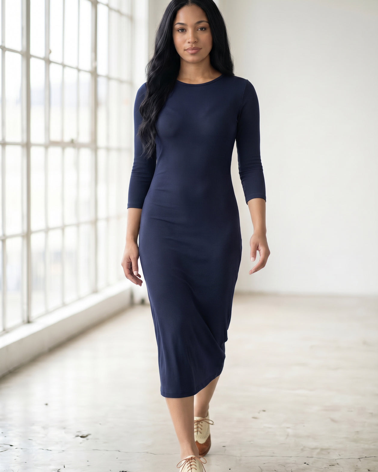 Model wearing Nuggles® Ribbed Midi Layering Dress in Navy