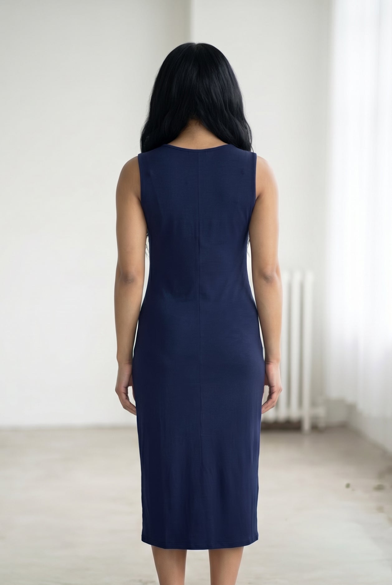 Model wearing Nuggles® Tank Midi Dress in Navy