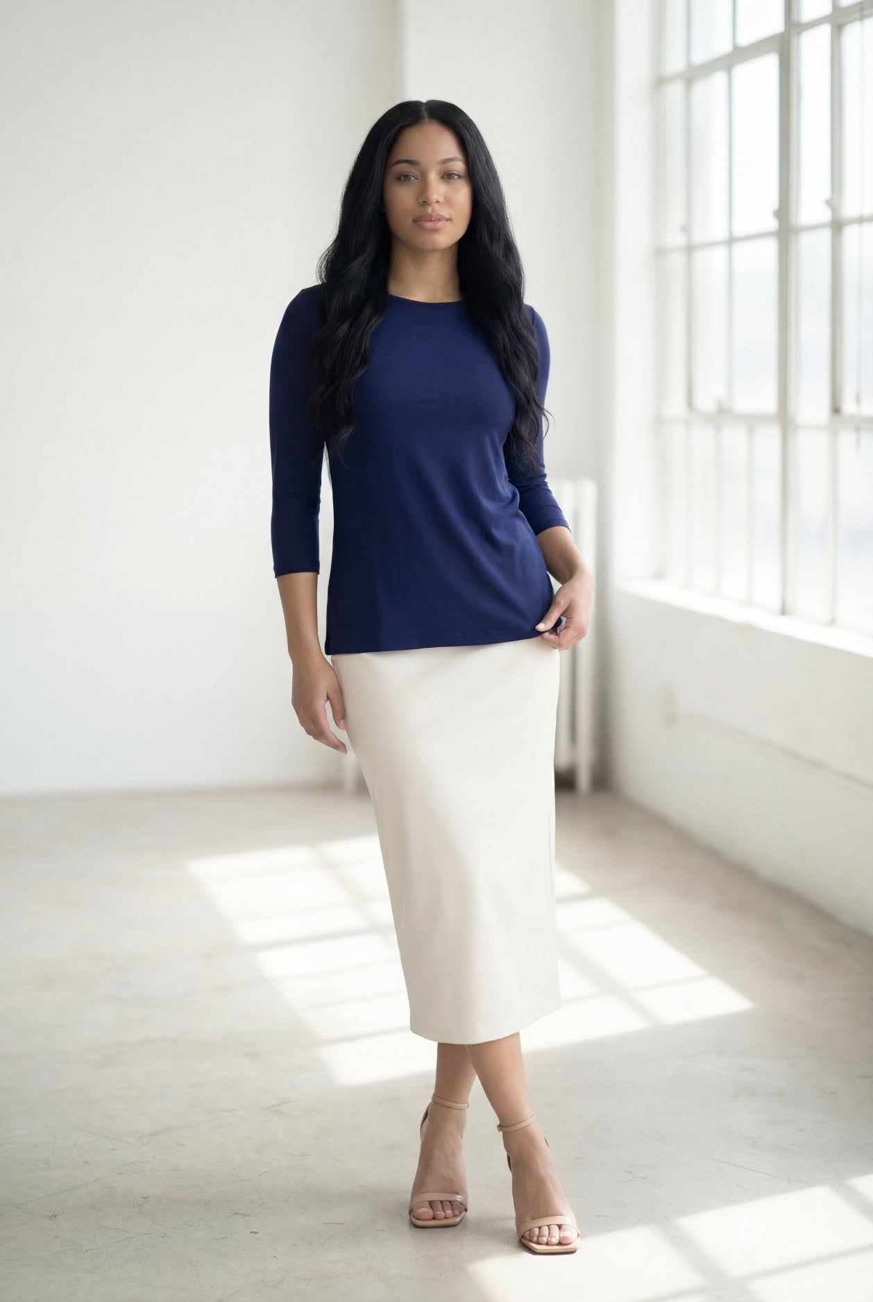 Model wearing Nuggles® 3/4 Essential Tee in Navy