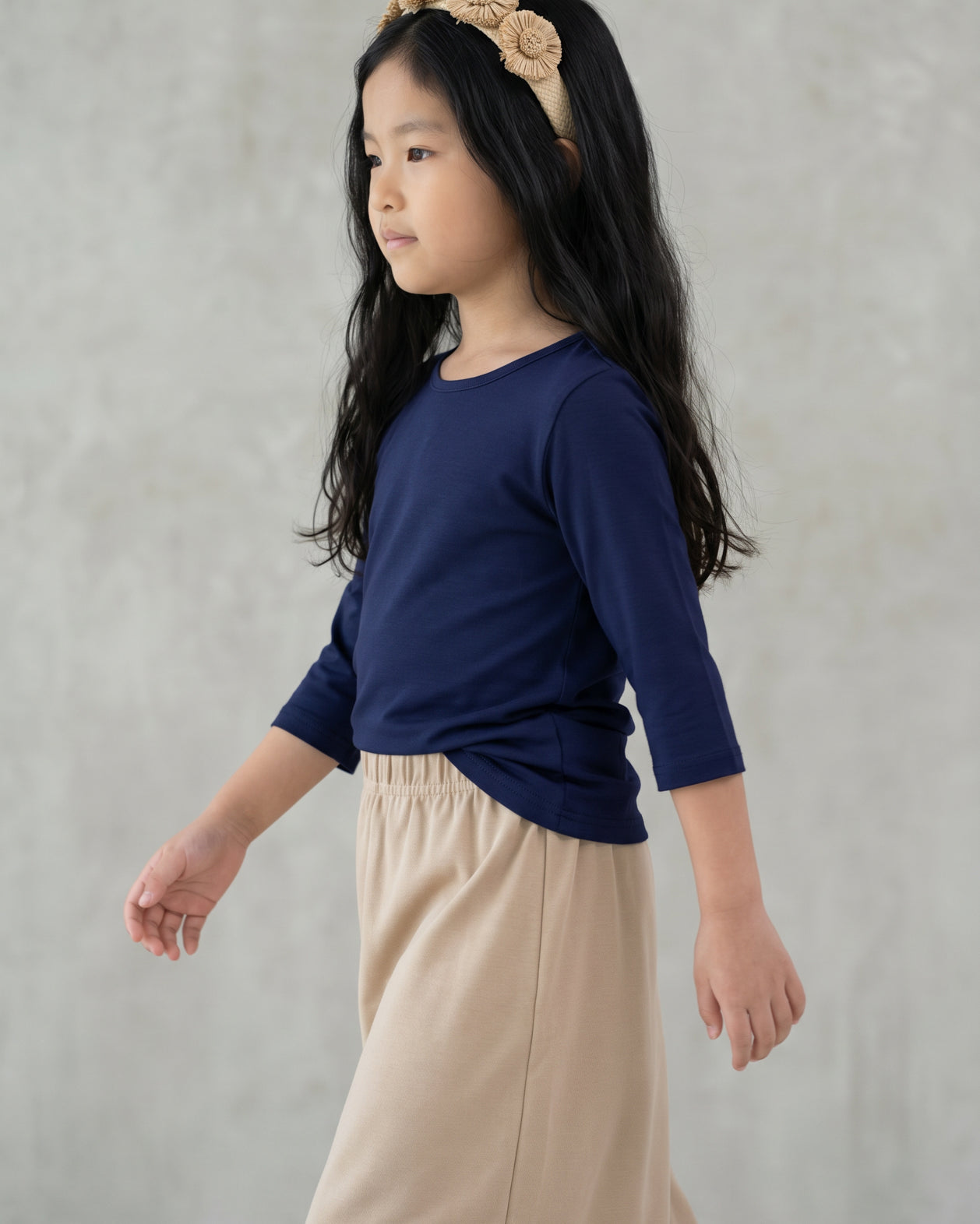 Model wearing the Girls' Nuggles® Essential 3/4 Tee in Navy