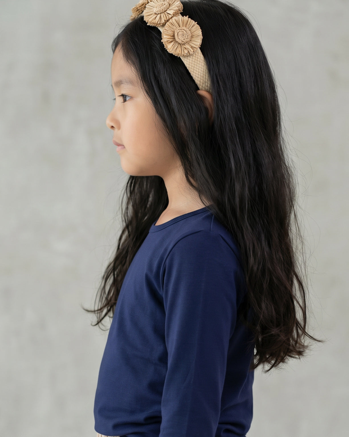 Model wearing the Girls' Nuggles® Essential 3/4 Tee in Navy