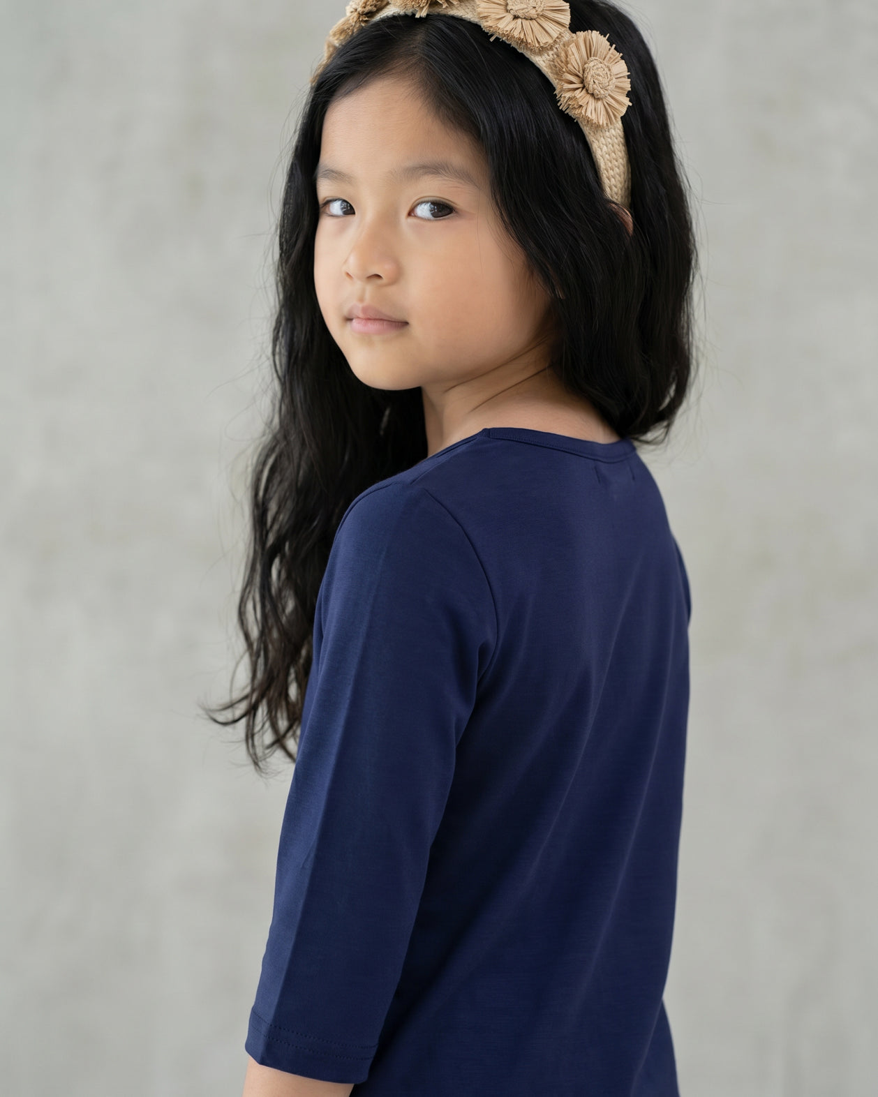 Model wearing the Girls' Nuggles® Essential 3/4 Tee in Navy