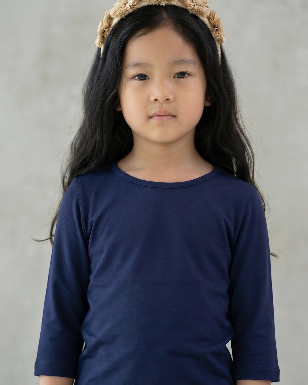 Model wearing the Girls' Nuggles® Essential 3/4 Tee in Navy