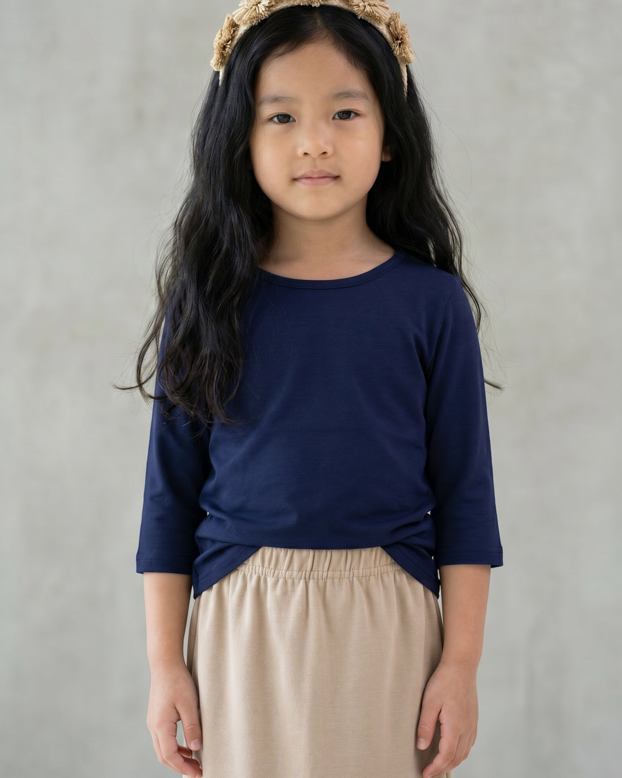 Model wearing the Girls' Nuggles® Essential 3/4 Tee in Navy